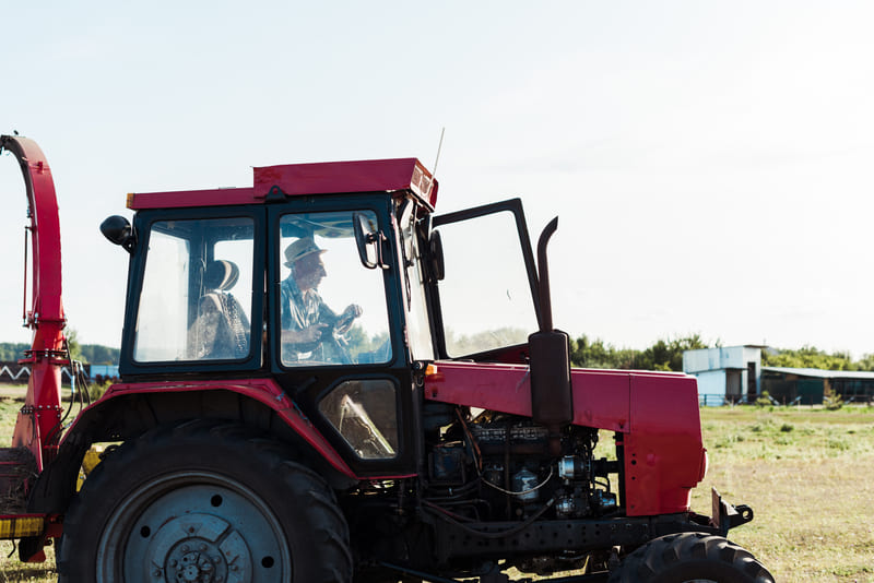 A custom farm tractor designed for efficiency, featuring unique modifications and a robust build for agricultural tasks.