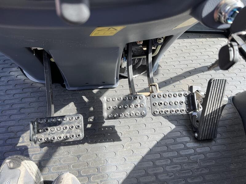 Image of a farm tractor showcasing its brake type, highlighting the essential components for effective stopping power.