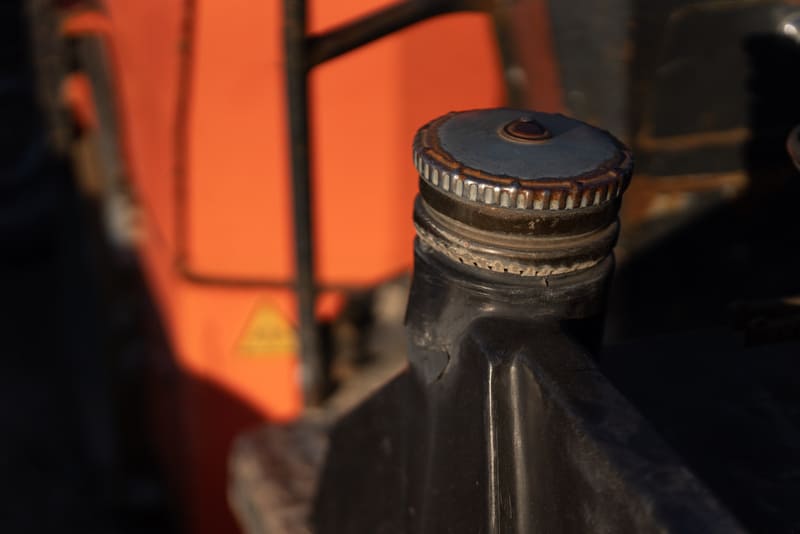 A detailed view of a farm tractor's coolant system, showcasing its components and connections for efficient engine cooling.
