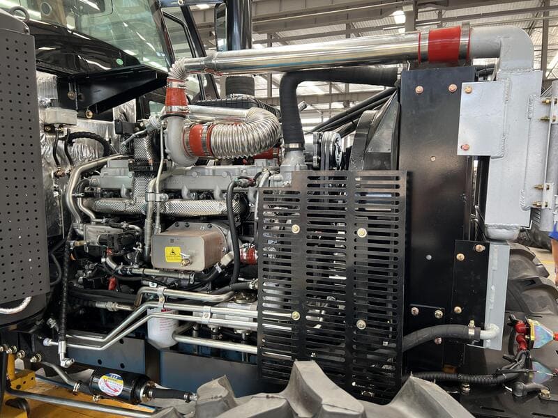 A powerful farm tractor equipped with a robust diesel engine, designed for agricultural tasks and efficient fieldwork.