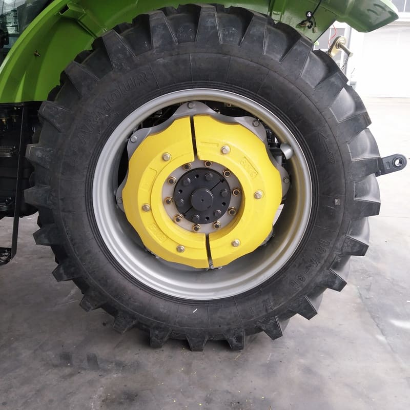 Close-up of a farm tractor's rear ballast, showcasing its robust design and essential role in enhancing stability during operation.