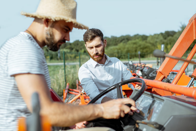 A farm tractor being operated during a training session, showcasing agricultural skills and safety practices.