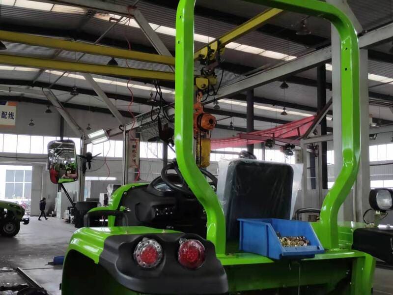 A farm tractor equipped with a Rollover Protective Structure (ROPS) for enhanced safety during operation in the field.