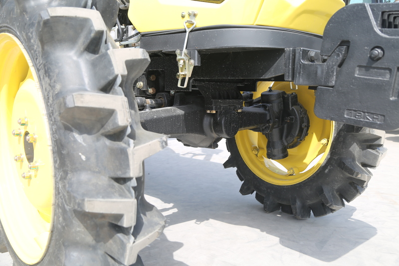 A close-up view of right farm tractor tires showcasing their rugged tread and durable design for agricultural use.