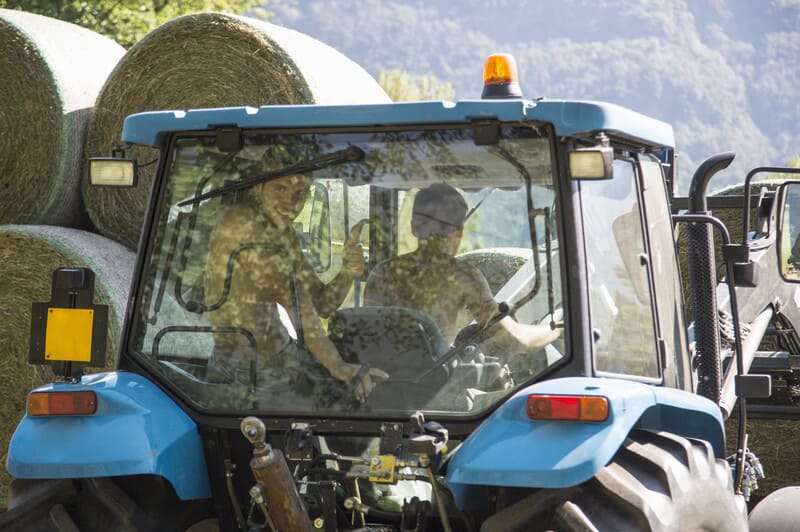 A close-up view of a tractor's base, showcasing its sturdy frame and essential components for agricultural work.