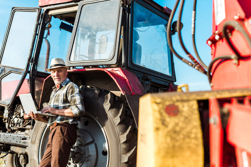 A modern tractor working efficiently in a field, showcasing advanced technology and optimal performance in agriculture.