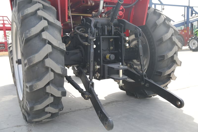 A close-up view of a tractor's Power Take-Off (PTO) mechanism, showcasing its connection and functionality in agricultural equipment.