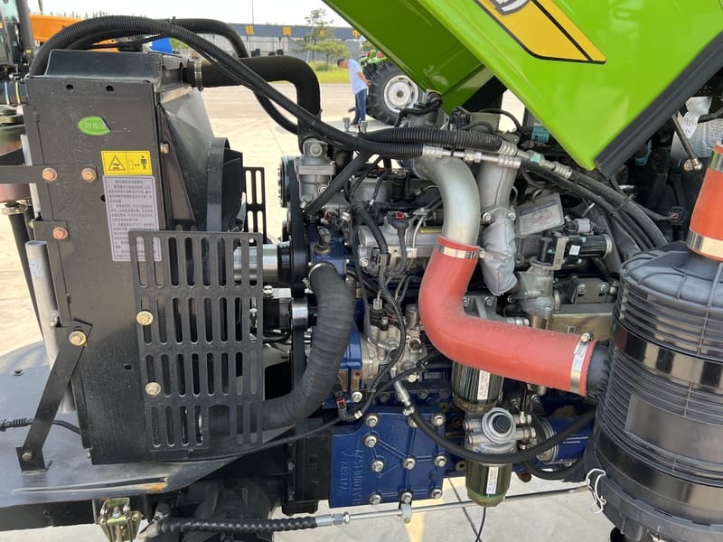 A close-up of a 100HP tractor engine, highlighting its powerful design and key components for efficient farm operations.