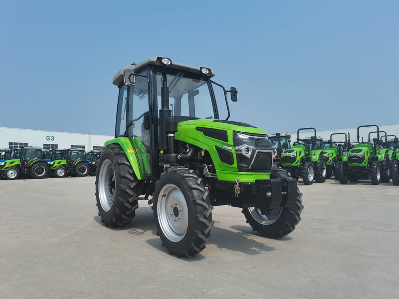 A 60HP green utility tractor with a fully enclosed cab, designed for versatile farming tasks.