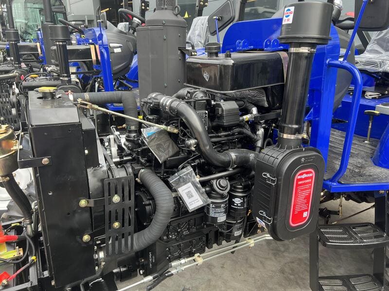 A close-up of a tractor fuel system, including the fuel tank, filters, and injectors for optimal engine performance.