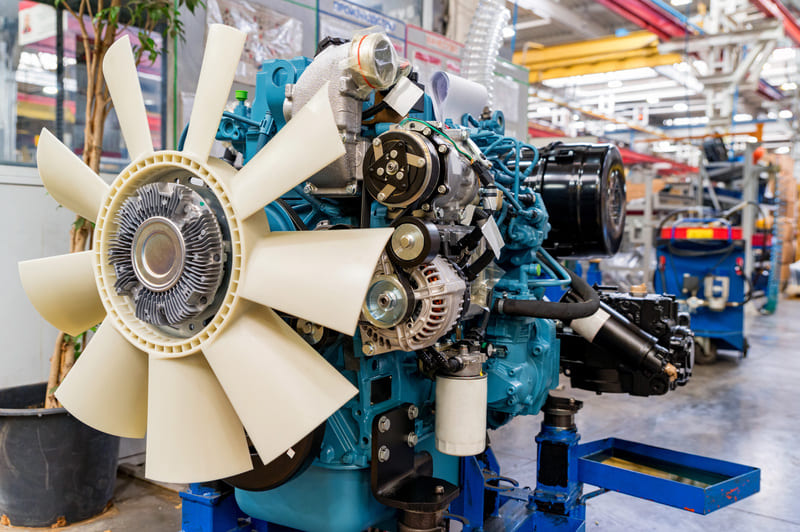 A close-up of a turbocharged diesel engine in a farm tractor, showcasing the turbo system for enhanced power and efficiency.