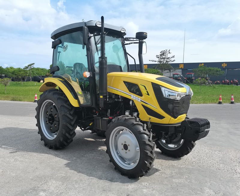 An 80HP farm tractor working in a field, showcasing its power and versatility for mid-sized agricultural tasks.