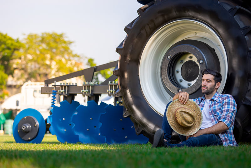 A custom farm tractor outfitted with specialized attachments, oversized tires, and upgraded cab technology tailored to specific agricultural tasks.