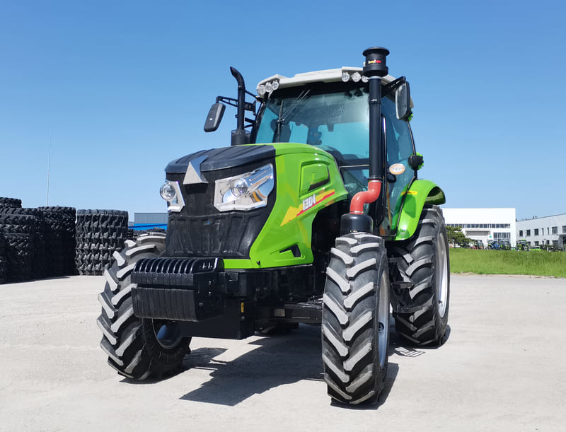 A diesel farm tractor operating in a field, built for high torque and fuel-efficient performance during heavy-duty agricultural work.